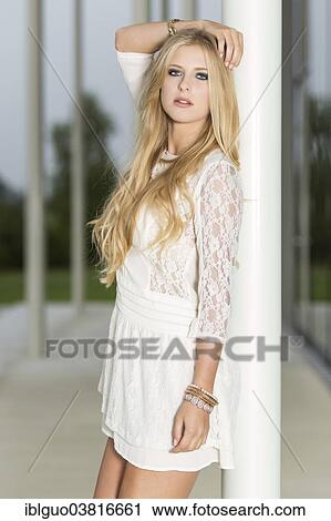 Woman wearing a short white dress View Large Photo Image Stock Image - Woman wearing a short white dress. Fotosearch