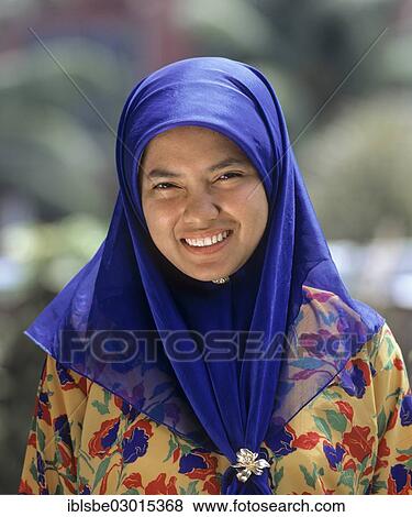 Stock Photo - "Woman wearing a traditional costume, headscarf, Tudung, portrait, Malaysia, Asia". Fotosearch