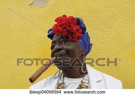 "Woman with a cigar, Havana, Ciudad de La Habana, Cuba, North America" View Large Photo Image Picture - "Woman with a cigar, Havana, Ciudad de La Habana, Cuba, North America". Fotosearch