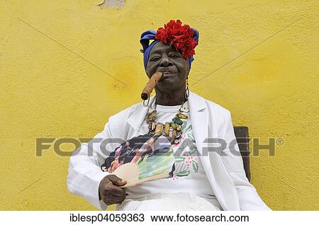 "Woman with a cigar, Havana, Ciudad de La Habana, Cuba, North America" View Large Photo Image Stock Image - "Woman with a cigar, Havana, Ciudad de La Habana, Cuba, North America". Fotosearch