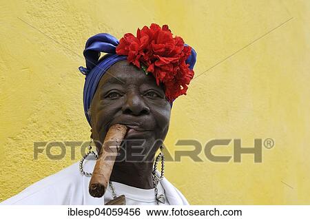 "Woman with a cigar, Havana, Ciudad de La Habana, Cuba, North America" View Large Photo Image Stock Photograph - "Woman with a cigar, Havana, Ciudad de La Habana, Cuba, North America". Fotosearch