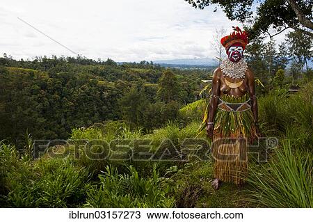 "Woman with a colourfully decorated costume and face paint is celebrating at the traditional Sing Sing gathering in the highlands, Paya, Papua New Guinea, Oceania" View Large Photo Image Stock Image - "Woman with a colourfully decorated costume and face paint is celebrating at the traditional Sing Sing gathering in the highlands, Paya, Papua New Guinea, Oceania". Fotosearch
