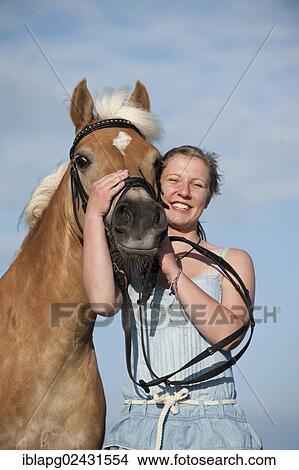 "Woman with a Haflinger horse, St. Peter-Ording, Schleswig-Holstein, Germany, Europe" View Large Photo Image Picture - "Woman with a Haflinger horse, St. Peter-Ording, Schleswig-Holstein, Germany, Europe". Fotosearch
