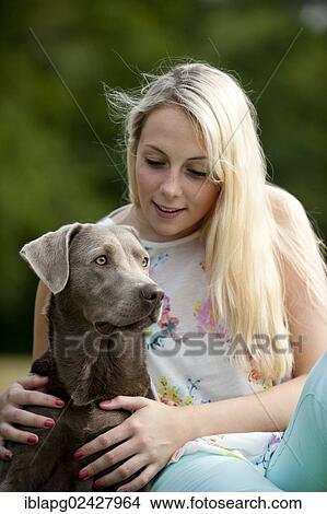 Woman with a Labrador Retriever View Large Photo Image Picture - Woman with a Labrador Retriever. Fotosearch