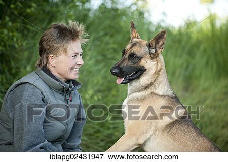 Woman with a Malinois or Belgian Shepherd Dog View Large Photo Image Stock Photo - Woman with a Malinois or Belgian Shepherd Dog. Fotosearch