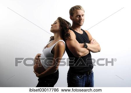 Woman with a pregnant belly leaning on man's shoulder View Large Photo Image Stock Photograph - Woman with a pregnant belly leaning on man's shoulder. Fotosearch