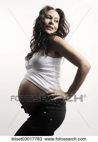 Stock Image - Woman with a pregnant belly. Fotosearch