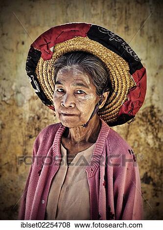 Stock Photo - "Woman with a straw hat, portrait, Burma, Myanmar, Southeast Asia, Asia". Fotosearch