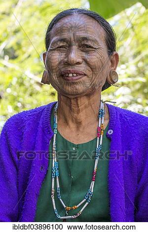 "Woman with a traditional facial tattoo and ear jewelry, ethnic group of the Chin, ethnic minority, portrait, Rakhine State, Myanmar, Asia" View Large Photo Image Stock Image - "Woman with a traditional facial tattoo and ear jewelry, ethnic group of the Chin, ethnic minority, portrait, Rakhine State, Myanmar, Asia". Fotosearch