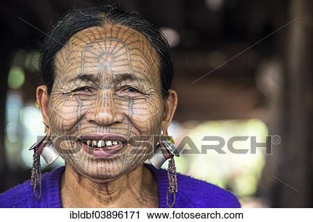"Woman with a traditional facial tattoo and ear jewelry, ethnic group of the Chin, ethnic minority, portrait, Rakhine State, Myanmar, Asia" View Large Photo Image Stock Image - "Woman with a traditional facial tattoo and ear jewelry, ethnic group of the Chin, ethnic minority, portrait, Rakhine State, Myanmar, Asia". Fotosearch