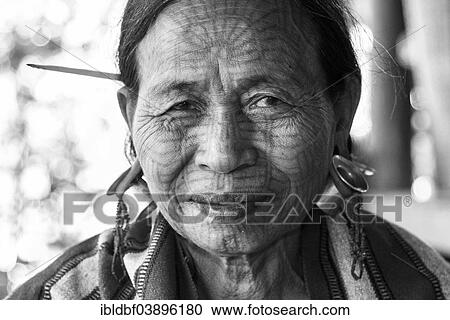 "Woman with a traditional facial tattoo and ear jewelry, ethnic group of the Chin, ethnic minority, portrait, Rakhine State, Myanmar, Asia" View Large Photo Image Stock Image - "Woman with a traditional facial tattoo and ear jewelry, ethnic group of the Chin, ethnic minority, portrait, Rakhine State, Myanmar, Asia". Fotosearch