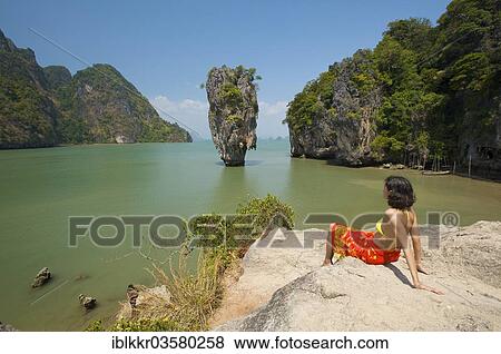 "Woman with a view of Khao Phing Kan or James Bond Island, Krabi, Thailand, Asia" View Large Photo Image Stock Photo - "Woman with a view of Khao Phing Kan or James Bond Island, Krabi, Thailand, Asia". Fotosearch