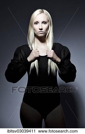 Stock Image - Woman with long blond hair. Fotosearch