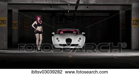 Woman with pink hair and tattoos standing next to a white sports car View Large Photo Image Stock Image - Woman with pink hair and tattoos standing next to a white sports car. Fotosearch