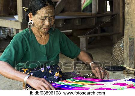 "Woman with traditional facial tattoos and ear jewellery from the Chin people, ethnic group, the last of their kind, weaving on a loom, Rakhine State, Myanmar, Asia" View Large Photo Image Stock Photo - "Woman with traditional facial tattoos and ear jewellery from the Chin people, ethnic group, the last of their kind, weaving on a loom, Rakhine State, Myanmar, Asia". Fotosearch