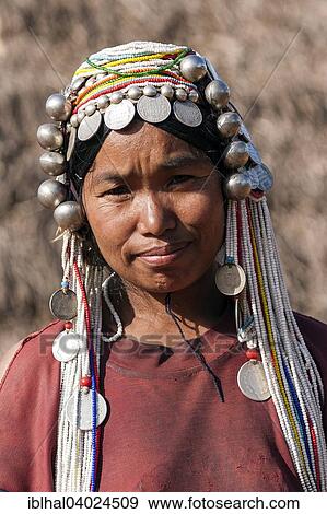 "Woman with traditional headdress, Akha tribe, Kyaing Tong, Myanmar, Asia" View Large Photo Image Stock Photo - "Woman with traditional headdress, Akha tribe, Kyaing Tong, Myanmar, Asia". Fotosearch