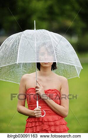 "Woman with umbrella outside in a summer rain, Lake Constance, Lindau - Bodensee, Bavaria, Germany, Europe" View Large Photo Image Stock Image - "Woman with umbrella outside in a summer rain, Lake Constance, Lindau - Bodensee, Bavaria, Germany, Europe". Fotosearch