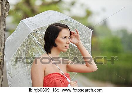 "Woman with umbrella outside in a summer rain, Lake Constance, Lindau - Bodensee, Bavaria, Germany, Europe" View Large Photo Image Stock Photography - "Woman with umbrella outside in a summer rain, Lake Constance, Lindau - Bodensee, Bavaria, Germany, Europe". Fotosearch