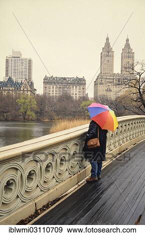 "Woman with umbrella standing on Bow Bridge, Central Park, historical photograph, Manhattan, New York City, New York, United States, North America" View Large Photo Image Stock Photo - "Woman with umbrella standing on Bow Bridge, Central Park, historical photograph, Manhattan, New York City, New York, United States, North America". Fotosearch