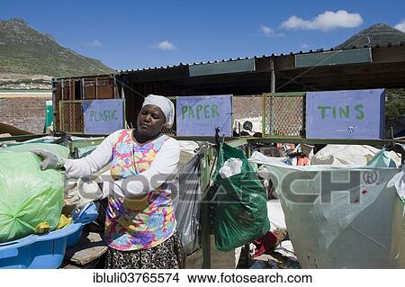 Picture - "Woman working at a collecting point for recycling, Hout Bay, Cape Town, South Africa, Africa". Fotosearch