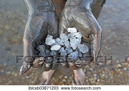 "Woman's hands holding salt crystals, hands covered in salty mud from the Dead Sea, Suwayma, Jordan, Asia" View Large Photo Image Stock Image - "Woman's hands holding salt crystals, hands covered in salty mud from the Dead Sea, Suwayma, Jordan, Asia". Fotosearch