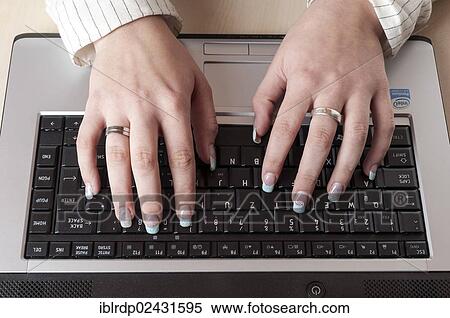 Stock Photography - Woman's hands on a computer keyboard. Fotosearch