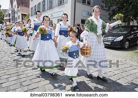 "Women and children during a parade through the historic town centre, Fischerstechen or water jousting festival, Ulm, Baden-Wurttemberg, Germany, Europe" View Large Photo Image Stock Image - "Women and children during a parade through the historic town centre, Fischerstechen or water jousting festival, Ulm, Baden-Wurttemberg, Germany, Europe". Fotosearch
