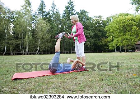 Women doing gymnastics outdoors View Large Photo Image Picture - Women doing gymnastics outdoors. Fotosearch