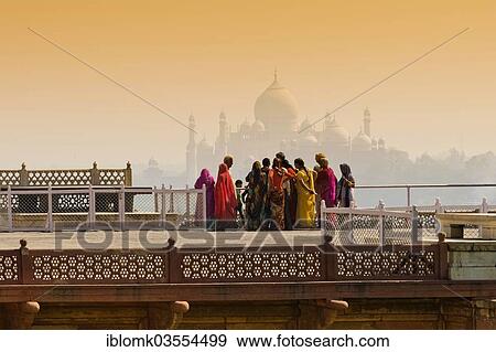 "Women dressed in colourful saris at the Red Fort, the Taj Mahal at back, Agra, Uttar Pradesh, India, Asia" View Large Photo Image Stock Photo - "Women dressed in colourful saris at the Red Fort, the Taj Mahal at back, Agra, Uttar Pradesh, India, Asia". Fotosearch