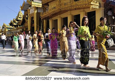 "Women during a Buddhist ceremony at Shwedagon Pagoda, Yangon, Yangon Region, Myanmar, Burma, Asia" View Large Photo Image Stock Photo - "Women during a Buddhist ceremony at Shwedagon Pagoda, Yangon, Yangon Region, Myanmar, Burma, Asia". Fotosearch