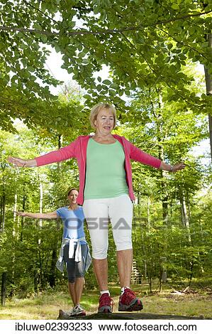 Women exercising on an outdoor fitness trail View Large Photo Image Stock Image - Women exercising on an outdoor fitness trail. Fotosearch