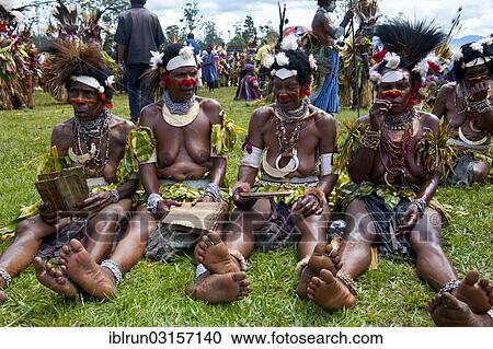 "Women in colourfully decorated costumes with face paint at the traditional sing-sing gathering, Hochland, Mount Hagen, Western Highlands Province, Papua New Guinea, Oceania" View Large Photo Image Stock Image - "Women in colourfully decorated costumes with face paint at the traditional sing-sing gathering, Hochland, Mount Hagen, Western Highlands Province, Papua New Guinea, Oceania". Fotosearch