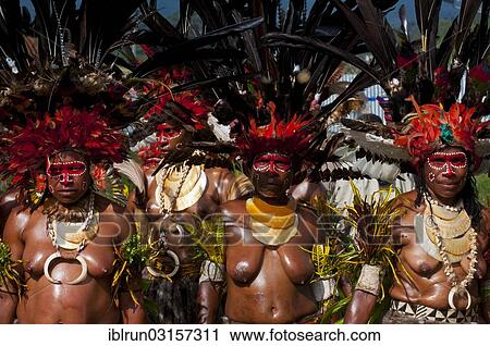 "Women in colourfully decorated costumes with face paint at the traditional sing-sing gathering, Hochland, Mount Hagen, Western Highlands Province, Papua New Guinea, Oceania" View Large Photo Image Stock Image - "Women in colourfully decorated costumes with face paint at the traditional sing-sing gathering, Hochland, Mount Hagen, Western Highlands Province, Papua New Guinea, Oceania". Fotosearch