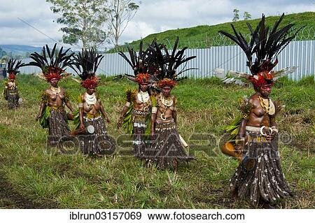 "Women in colourfully decorated costumes with face paint at the traditional sing-sing gathering, Hochland, Mount Hagen, Western Highlands Province, Papua New Guinea, Oceania" View Large Photo Image Stock Photo - "Women in colourfully decorated costumes with face paint at the traditional sing-sing gathering, Hochland, Mount Hagen, Western Highlands Province, Papua New Guinea, Oceania". Fotosearch