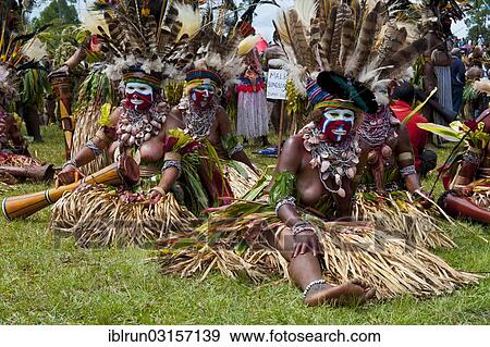 "Women in colourfully decorated costumes with face paint at the traditional sing-sing gathering, Hochland, Mount Hagen, Western Highlands Province, Papua New Guinea, Oceania" View Large Photo Image Stock Photo - "Women in colourfully decorated costumes with face paint at the traditional sing-sing gathering, Hochland, Mount Hagen, Western Highlands Province, Papua New Guinea, Oceania". Fotosearch