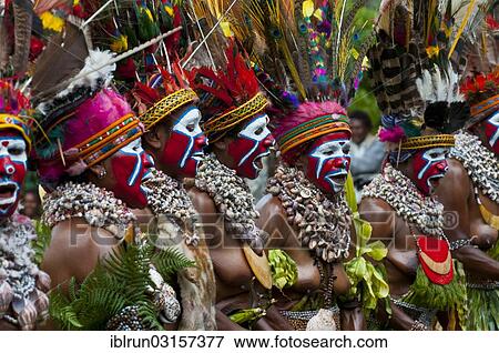 "Women in colourfully decorated costumes with face paint are celebrating at the traditional Sing Sing gathering in the highlands, Paya, Papua New Guinea, Oceania" View Large Photo Image Stock Photo - "Women in colourfully decorated costumes with face paint are celebrating at the traditional Sing Sing gathering in the highlands, Paya, Papua New Guinea, Oceania". Fotosearch