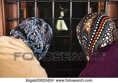 Picture - "Women looking through a window, Mevlana or Rumi mausoleum, Konya, Anatolia, Turkey, Asia". Fotosearch