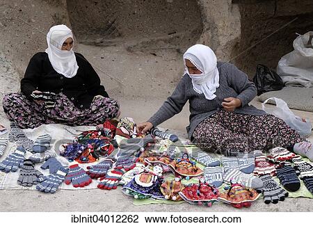 Stock Image - "Women offering handicrafts, Soganli Valley, Kayseri Province, Cappadocia, Turkey, Asia". Fotosearch