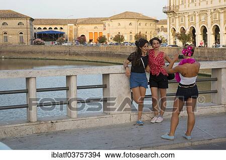 "Women posing on the bridge crossing the Nevole River during the Summer Jamboree Rock'n'Roll Festival, historic center, Senigallia, Province of Ancona, Italy, Europe" View Large Photo Image Picture - "Women posing on the bridge crossing the Nevole River during the Summer Jamboree Rock'n'Roll Festival, historic center, Senigallia, Province of Ancona, Italy, Europe". Fotosearch