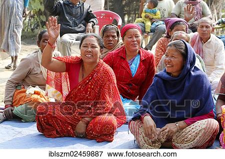 "Women raising their hands at a community gathering near Birathnagar, Terai region, Nepal, Asia" View Large Photo Image Stock Photo - "Women raising their hands at a community gathering near Birathnagar, Terai region, Nepal, Asia". Fotosearch