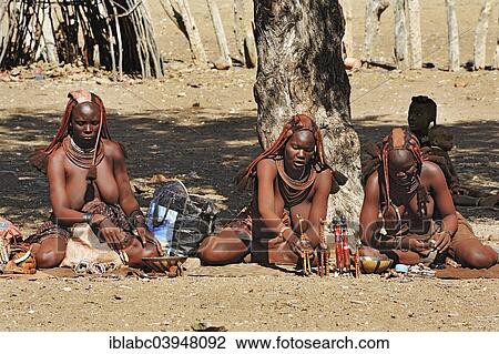 "Women selling carvings in a Himba village, near Opuwo, Namibia, Africa" View Large Photo Image Stock Image - "Women selling carvings in a Himba village, near Opuwo, Namibia, Africa". Fotosearch