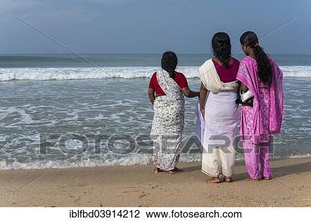"Women standing on the beach facing the sea, Varkala, Kerala, India, Asia" View Large Photo Image Stock Image - "Women standing on the beach facing the sea, Varkala, Kerala, India, Asia". Fotosearch