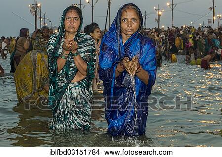 "Women taking a bath in the Sangam, the confluence of the rivers Ganges, Yamuna and Saraswati, in the early morning, Kumbha Mela mass Hindu pilgrimage, Allahabad, Uttar Pradesh, India, Asia" View Large Photo Image Picture - "Women taking a bath in the Sangam, the confluence of the rivers Ganges, Yamuna and Saraswati, in the early morning, Kumbha Mela mass Hindu pilgrimage, Allahabad, Uttar Pradesh, India, Asia". Fotosearch