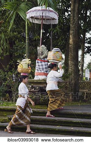 "Women taking offerings to the temple festival, Pura Dalem Puri Temple, Peliatan, Ubud, Bali, Indonesia, Asia" View Large Photo Image Stock Photo - "Women taking offerings to the temple festival, Pura Dalem Puri Temple, Peliatan, Ubud, Bali, Indonesia, Asia". Fotosearch