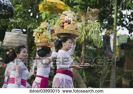 "Women taking offerings to the temple festival, Pura Dalem Puri Temple, Peliatan, Ubud, Bali, Indonesia, Asia" View Large Photo Image Stock Photography - "Women taking offerings to the temple festival, Pura Dalem Puri Temple, Peliatan, Ubud, Bali, Indonesia, Asia". Fotosearch
