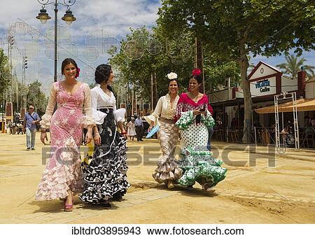 "Women wearing gypsy dresses at the Feria del Caballo, Jerez de la Frontera, Cadiz province, Andalusia, Spain, Europe" View Large Photo Image Stock Image - "Women wearing gypsy dresses at the Feria del Caballo, Jerez de la Frontera, Cadiz province, Andalusia, Spain, Europe". Fotosearch