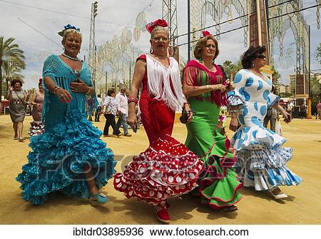 "Women wearing gypsy dresses at the Feria del Caballo, Jerez de la Frontera, Cadiz province, Andalusia, Spain, Europe" View Large Photo Image Stock Photograph - "Women wearing gypsy dresses at the Feria del Caballo, Jerez de la Frontera, Cadiz province, Andalusia, Spain, Europe". Fotosearch