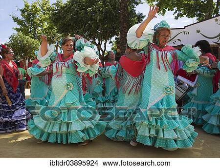"Women wearing gypsy dresses perform traditional Andalusian dances at the Feria del Caballo, Jerez de la Frontera, Cadiz province, Andalusia, Spain, Europe" View Large Photo Image Picture - "Women wearing gypsy dresses perform traditional Andalusian dances at the Feria del Caballo, Jerez de la Frontera, Cadiz province, Andalusia, Spain, Europe". Fotosearch