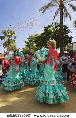 "Women wearing gypsy dresses perform traditional Andalusian dances at the Feria del Caballo, Jerez de la Frontera, Cadiz province, Andalusia, Spain, Europe" View Large Photo Image Stock Image - "Women wearing gypsy dresses perform traditional Andalusian dances at the Feria del Caballo, Jerez de la Frontera, Cadiz province, Andalusia, Spain, Europe". Fotosearch
