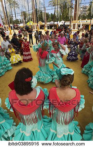 "Women wearing gypsy dresses perform traditional Andalusian dances at the Feria del Caballo, Jerez de la Frontera, Cadiz province, Andalusia, Spain, Europe" View Large Photo Image Stock Photograph - "Women wearing gypsy dresses perform traditional Andalusian dances at the Feria del Caballo, Jerez de la Frontera, Cadiz province, Andalusia, Spain, Europe". Fotosearch